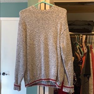 Men’s Sweater with red lined detail bottom.